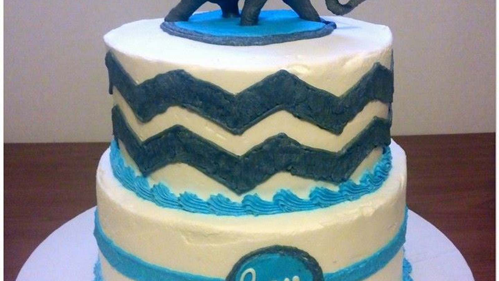 Elegant tiered baby shower cake by Cleveland Cake Boss — an example of a custom-designed cake born from a client consultation